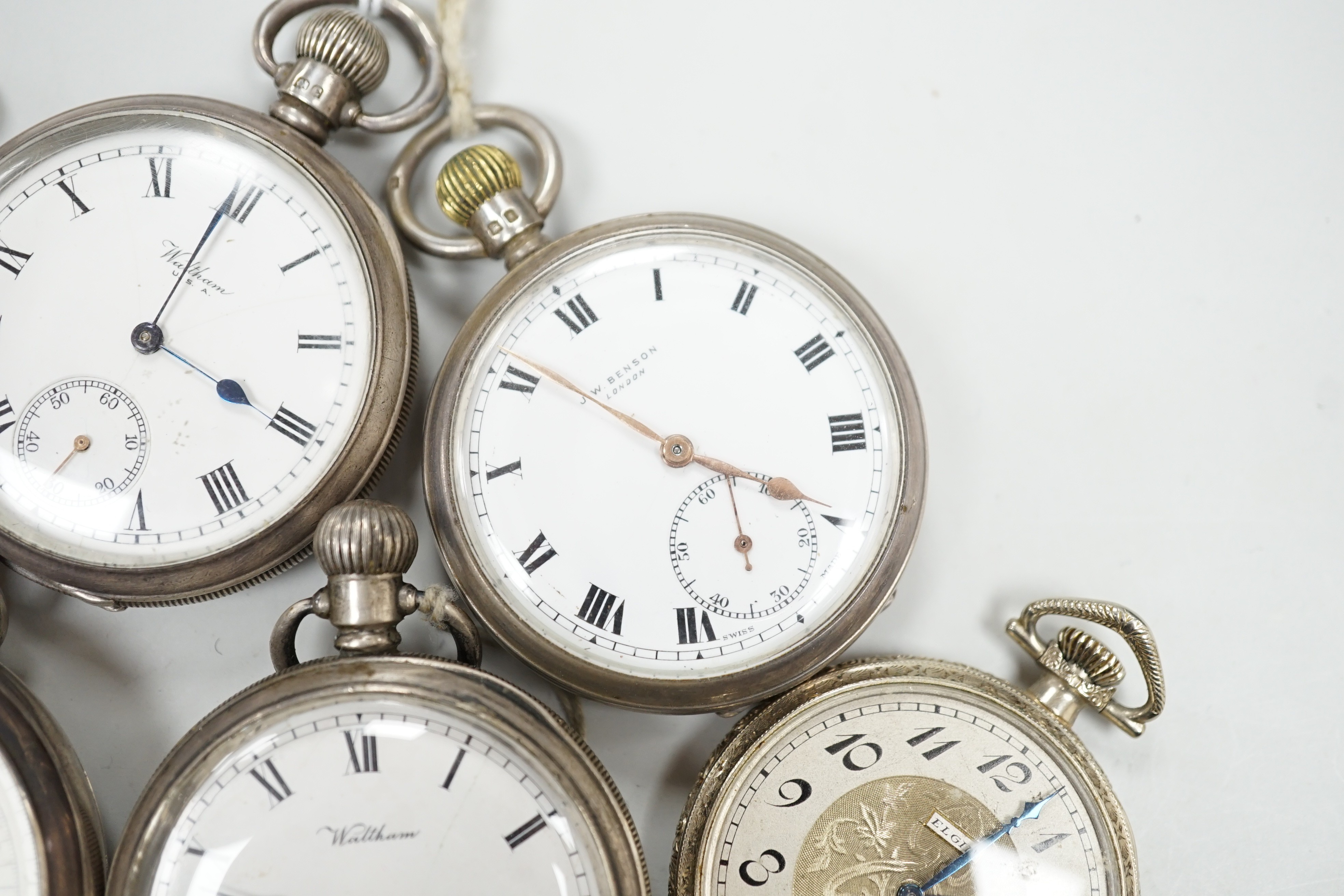 Four assorted silver open faced pocket watches including two Waltham and a J.W. Benson and two other base metal pocket watches.